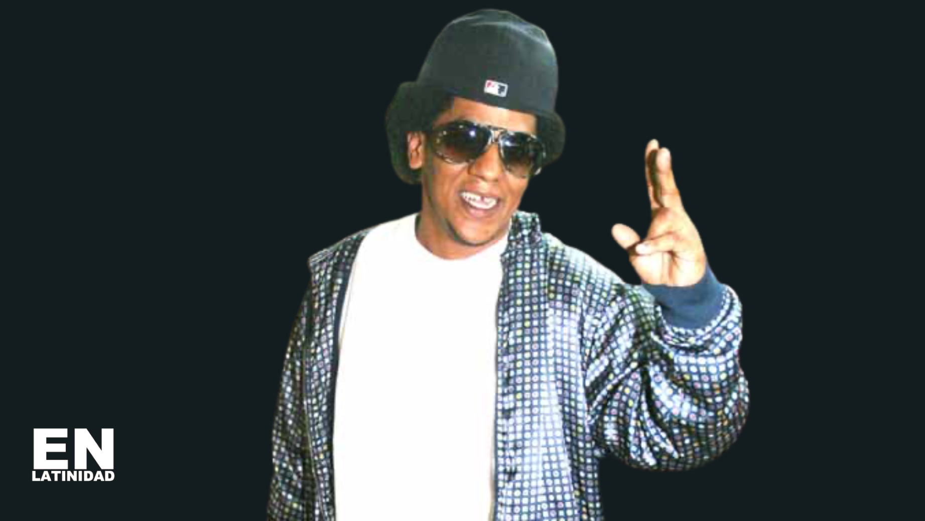 Tego Calderón performing live, blending salsa and reggaetón on stage, symbolizing Afro-Caribbean musical fusion.