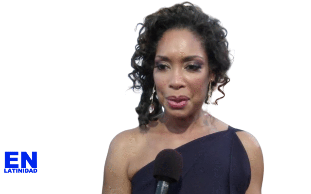 Afro-Latina actress Gina Torres on the 2019 Emmy Awards red carpet, elegantly dressed and smiling, highlighting the importance of Afro-Latino representation in mainstream Latino media.